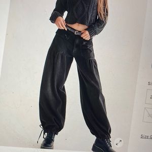 Free People Lotus jeans.  Black, wide leg cinched at ankle. New, $128.  Now $49.